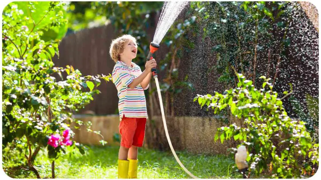 a person is watering their garden with a hose.