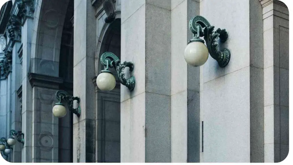 a row of light fixtures on the side of a building