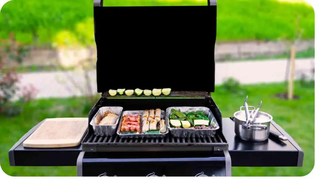 a grill with food on it and a black cover on it