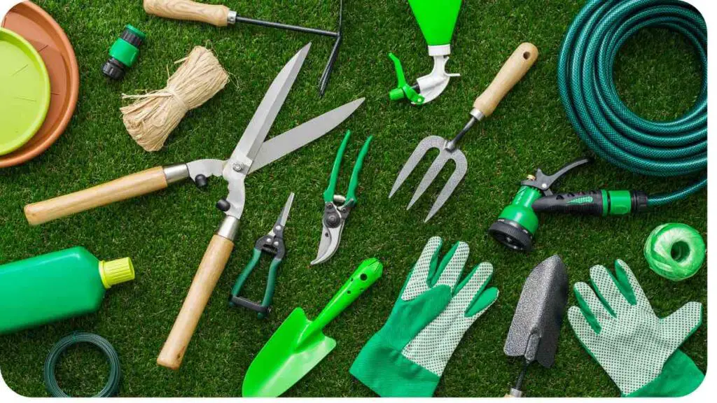 various gardening tools laid out on the grass