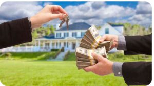 two people handing money to each other with a house in the background