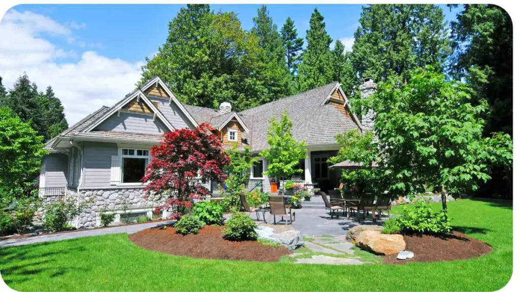 a house with a lawn and trees in front of it