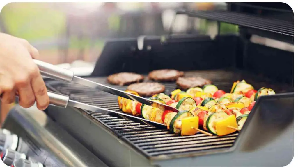 a person grilling vegetables on a grill with tongs